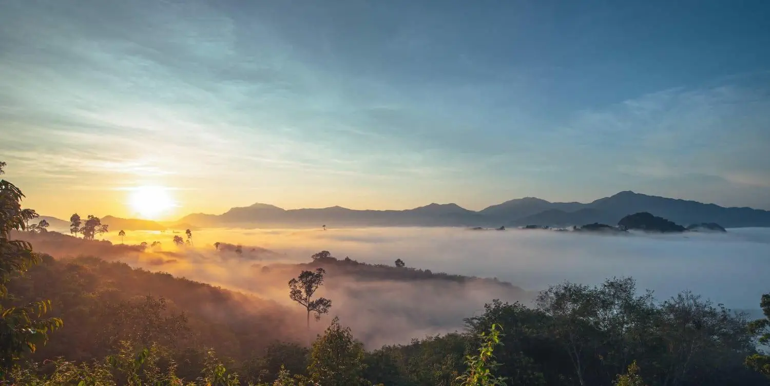 sunrise mountain range with colorful sky amazing landscape sea mist tropicana